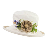 ladies cream hat with hessian button lilac flower decoration on side of hat