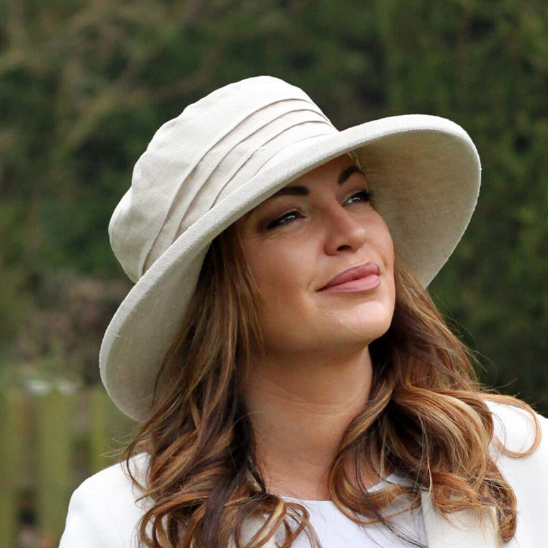 ladies cream sun hat on lady