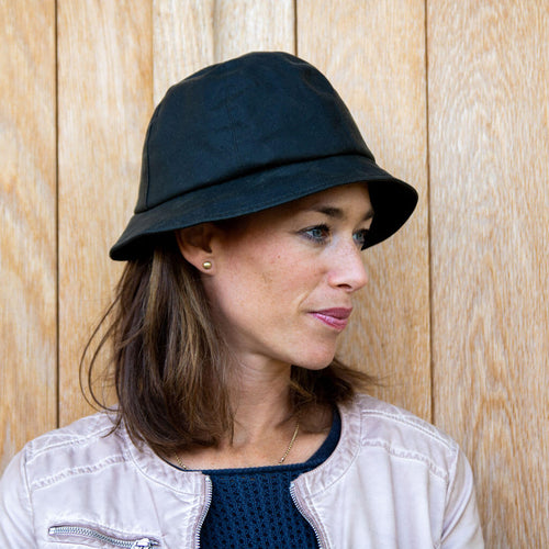 side view of ladies waxed cloche hat on lady